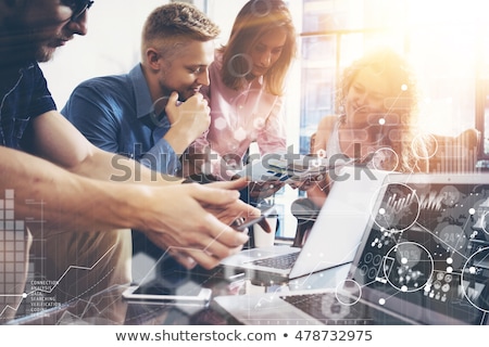 Foto stock: Business Woman Working On Laptop With Global Financial Report Co