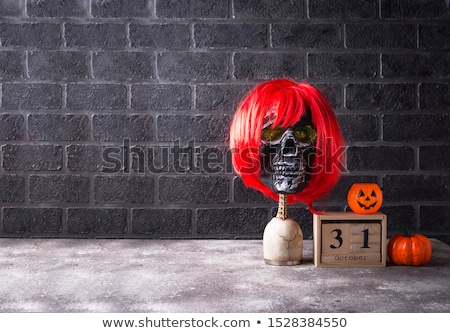 Stock photo: Human Skull With Red Wig