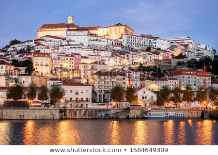 Foto stock: View Of Coimbra In Portugal And Mondego River At Night