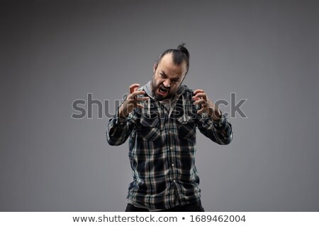 Stok fotoğraf: Bearded Man Showing Aggressive Grimace