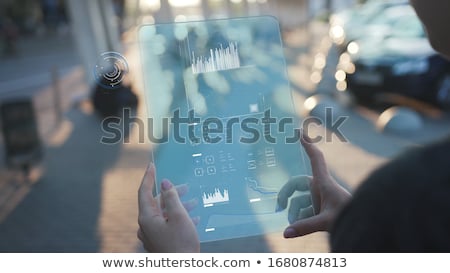 Сток-фото: Holding Futuristic Tablet New Media Concept