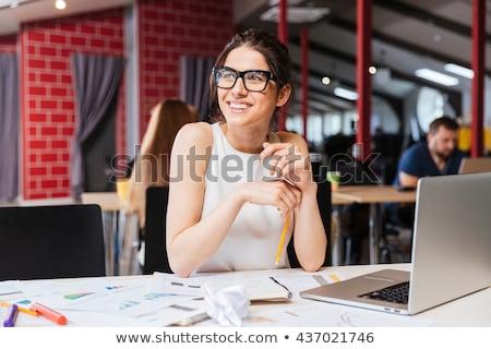 Foto stock: Beautiful Smiling Business Woman Working On Laptop