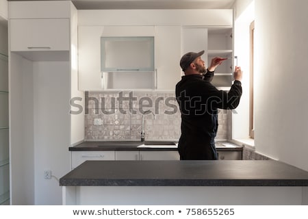 Сток-фото: Man Working On Kitchen Remodel