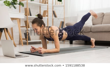 Сток-фото: Young Woman Doing Yoga Exercises