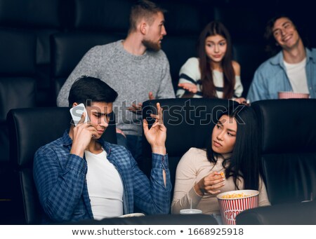 Stockfoto: Annoying Man On The Phone During Movie