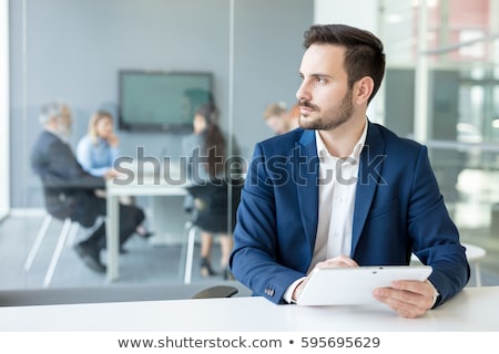 Stock fotó: Worried Man Using Digital Tablet