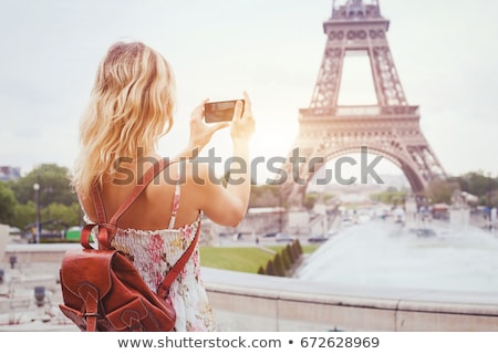 [[stock_photo]]: Blond Tourist Girl Taking Photos With Smartphone