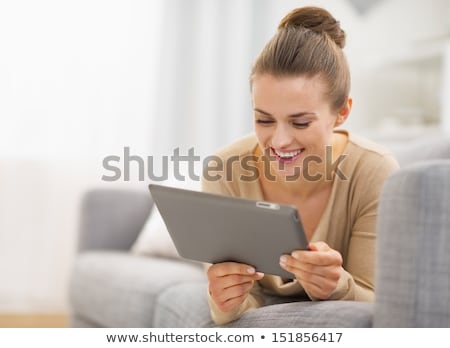 Stok fotoğraf: Young Beautiful Woman With A Tablet Pc At Home