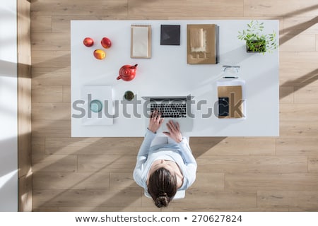 Stockfoto: Top View Of Businesswoman Sitting At Wooden Table And Working Wi