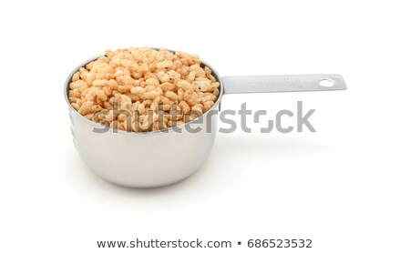 Stock photo: Crisped Rice Breakfast Cereal In A Measuring Cup