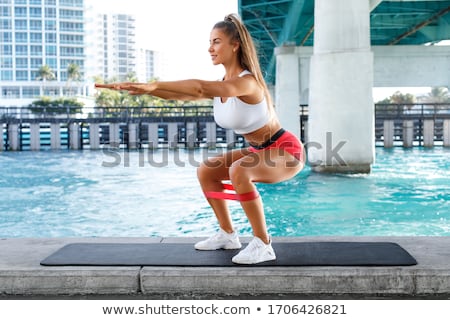 Stock fotó: Woman Doing Squat Exercise