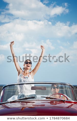 Stock photo: Happy Young Woman In Convertible Car