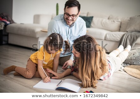 Zdjęcia stock: Woman Helping A Group Of Girls With Their Homework