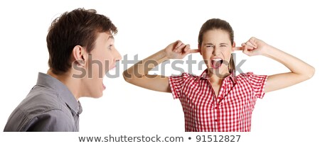 Foto d'archivio: Angry Girl Screaming Against A White Background