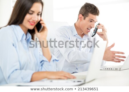 [[stock_photo]]: Man Yelling At Someone On Phone