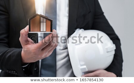 [[stock_photo]]: Architect Carrying An Architectural Model Building