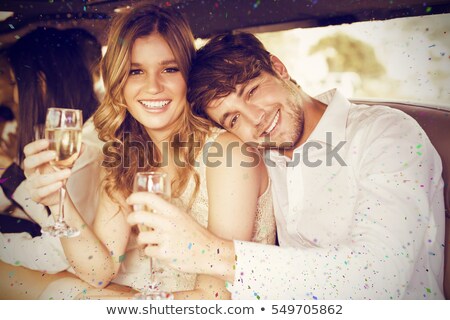 Zdjęcia stock: Portrait Of Happy Young Glamorous Couple With Champagne Flute In
