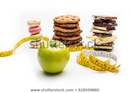 Foto stock: Macaroons Cookies Chocolate Bars And Measuring Tape Isolated On White