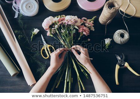 Foto stock: High Angle View Of Unrecognizable Florist Standing By Wooden Table