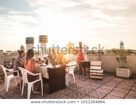 ストックフォト: Happy Friends Having Bbq Party On Rooftop