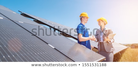 Stok fotoğraf: Construction Worker And Investor In Solar Power Plant Shaking Hands