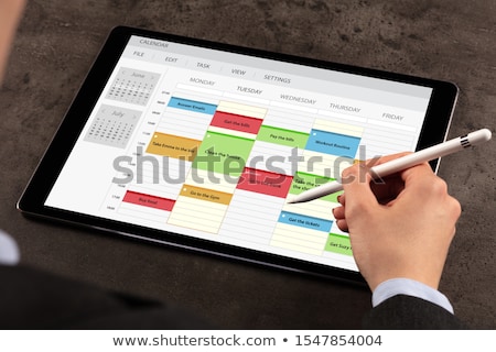 Zdjęcia stock: Business Woman Schedule Her Program On Tablet