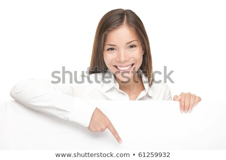 Stok fotoğraf: Successful Business Female Pointing At White Blank Billboard