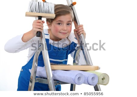 Stock fotó: Little Girl On A Ladder Holding A Brush And Wallpapers