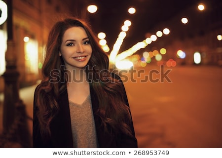 Сток-фото: Attractive Brunette Woman Against Night City