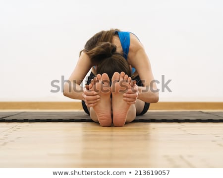 Stock fotó: Woman Stretching And Touching Her Toes