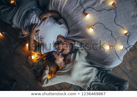 Beautiful Couple Lying On Floor Foto stock © Stasia04