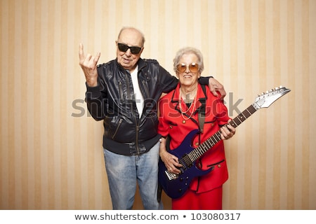 Stock photo: Fashion Couple Playing Electric Guitar