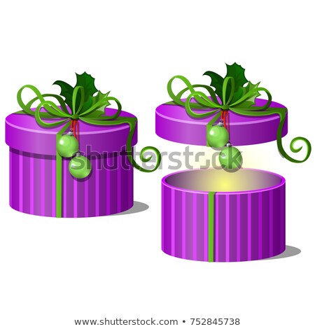 Zdjęcia stock: Set Of Ornate Gift Boxes Purple Color With Lids Tied With A Green Ribbon Bow With Leaves Of Holly Is