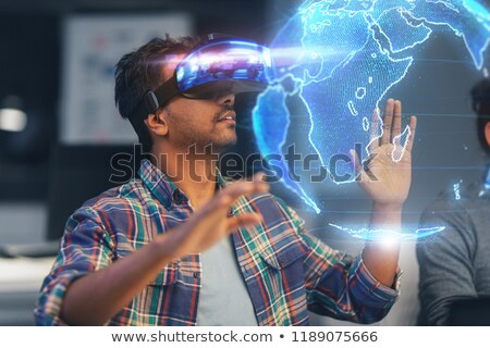 Сток-фото: Man In Vr Headset With Earth Hologram At Office