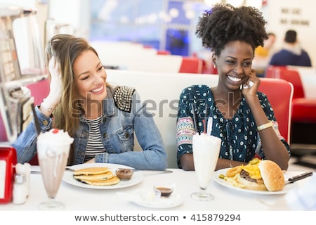 Сток-фото: Young Woman Eating Pancakes In The Diner