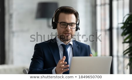 Stock fotó: Serious Entrepreneur In Formalwear Listening To Young Partner Or Colleague