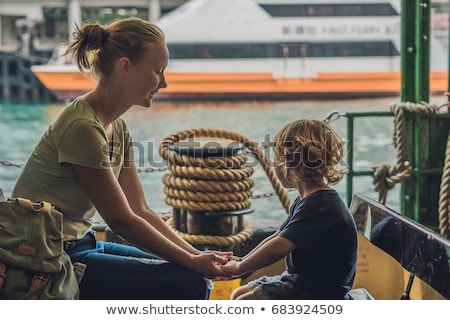 Stock fotó: Mom And Son Go By Ferry In Hong Kong