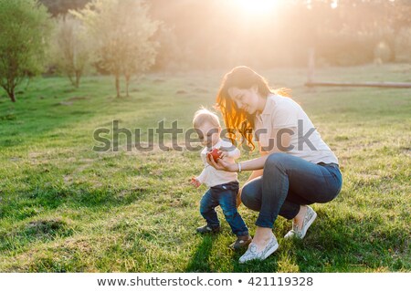 ストックフォト: Mans Hand Is Giving An Apple To The Women Hand