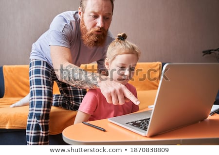 Foto stock: Handsome Father Helping Her Daughter For Homework