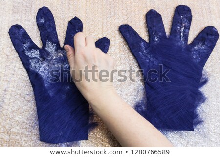 Stockfoto: Hand Spreading Wool On Sheeps Back