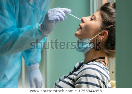 Stok fotoğraf: Laboratory Test Tube With Cotton Swab In Scientists Hand