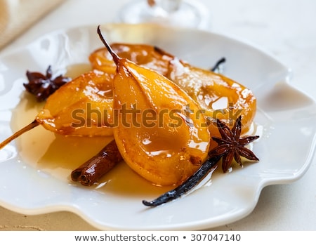 Stok fotoğraf: Poached Pear With Syrup And Spices