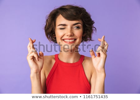 Stok fotoğraf: Attractive Woman With Crossed Fingers