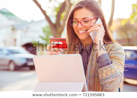 ストックフォト: Young Business Woman Using Mobile Phone Holding Credit Card