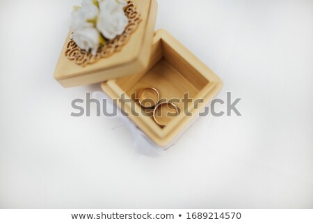 Stock fotó: Two Beautiful Golden Bridal Rings Lying In A Wooden Box