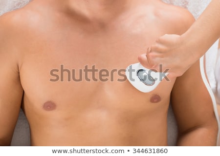 Foto stock: Beautician Giving Laser Depilation Treatment On Mans Chest