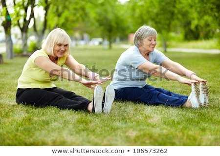 Foto stock: Senior Lady Enhancing Body Flexibility By Stretching