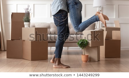 Foto stock: A Loving Couple Moving From House At Day Time