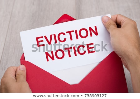 Stock photo: Person Holding Eviction Notice In Envelope