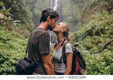 Foto stock: Romantic Couple Kissing In The Rainforest